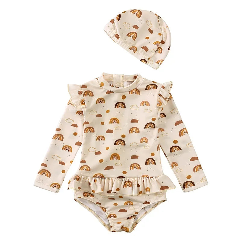 Boho Rainbow print baby and toddler girl long sleeve rash guard set with matching rainbow swim cap.