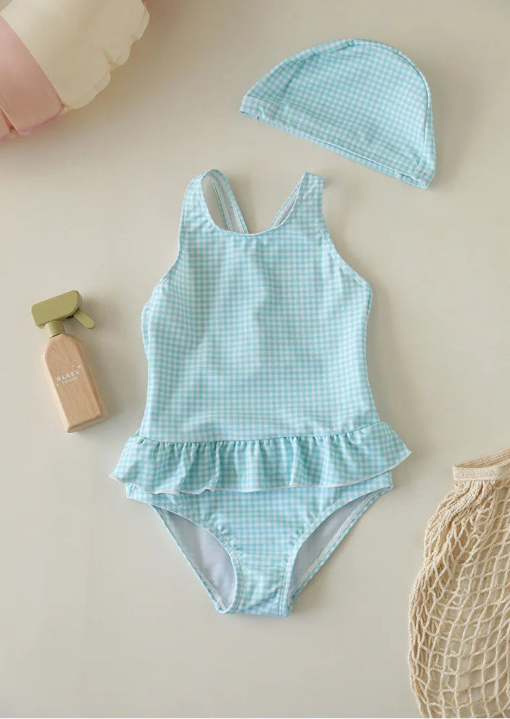 Toddler girls' Seafoam Mint Green checkered swimsuit with vintage-style ruffles and a coordinating mint green gingham swim cap on a neutral background.