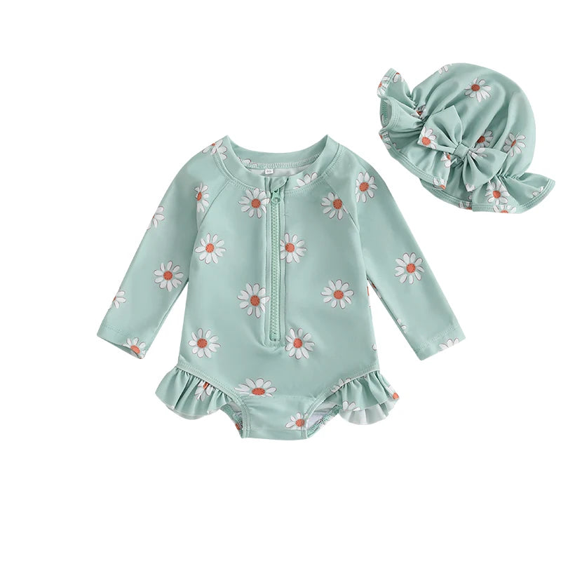 Sage green toddler girl long sleeve floral bathing suit with white daisies and matching green sun hat with bow detail.