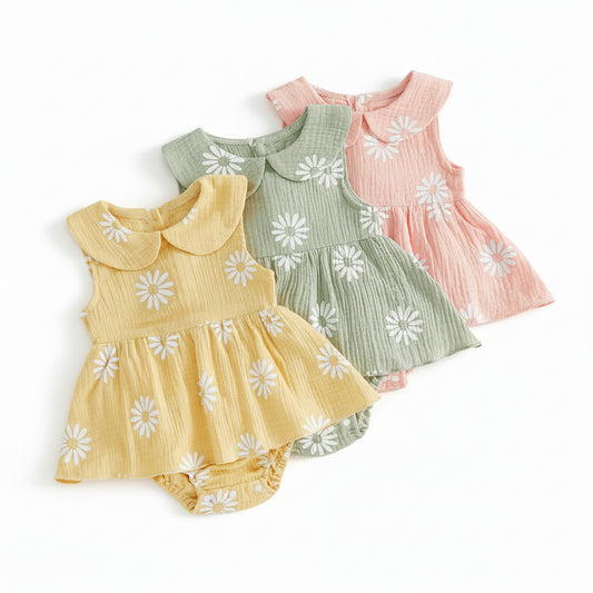 Three colors of the Kidsely baby girl daisy floral print romper dress displayed together in yellow, sage green, and petal pink.