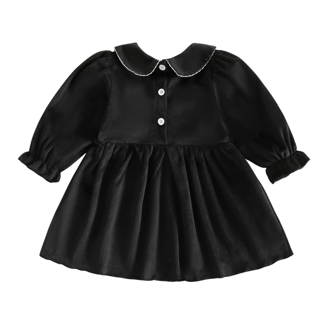Back view of the black baby and toddler girls Halloween dress showing the Peter Pan collar detail and three white button closures down the back.