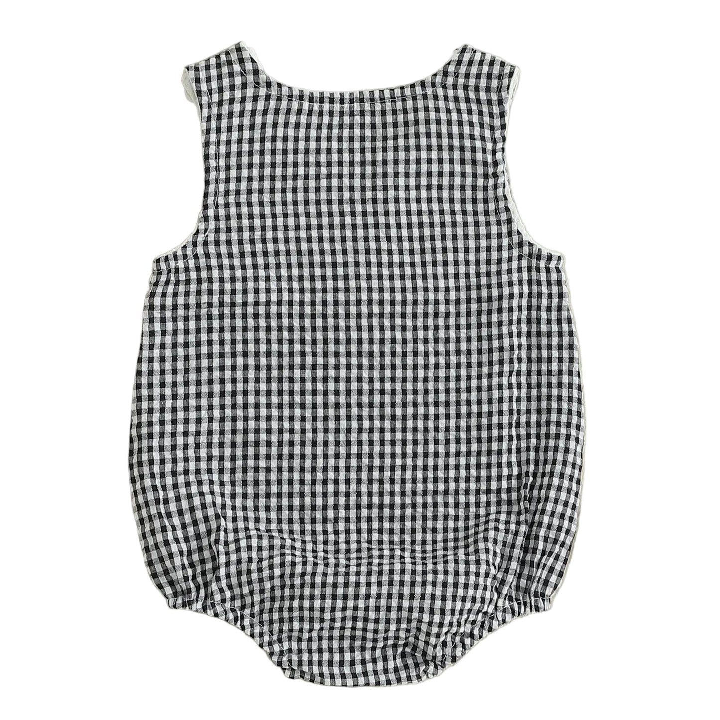 Full back view of the unisex black and white checkered seersucker baby bubble romper, highlighting the gathered elastic leg openings and relaxed bubble silhouette.