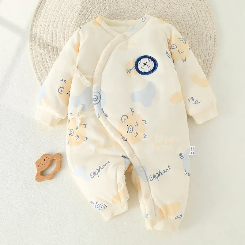Cream newborn cotton kimono romper featuring a blue elephant and peach pig pattern and side snap closure for easy dressing.