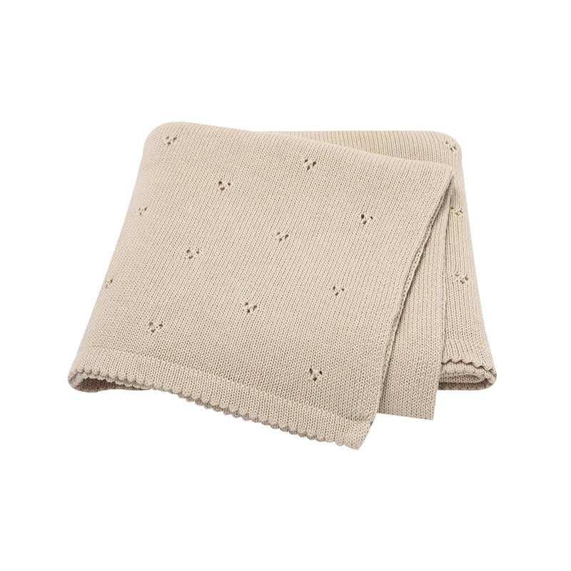 Neutral Sandy Beige 100% cotton knit baby blanket, perfect for gender-neutral nursery decor.