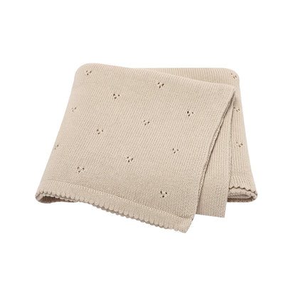 Neutral Sandy Beige 100% cotton knit baby blanket, perfect for gender-neutral nursery decor.