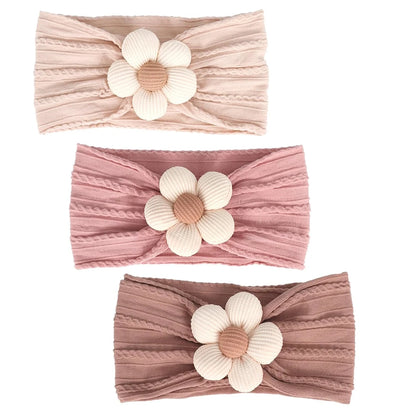 set of three neutral baby headbands in nude, dusty rose, and muted mauve cable knit nylon