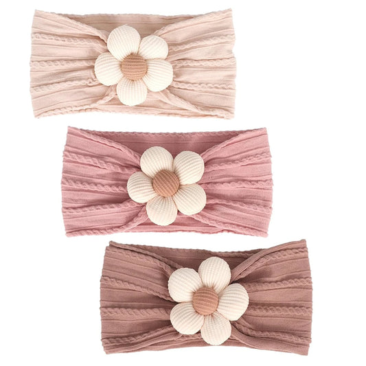 set of three neutral baby headbands in nude, dusty rose, and muted mauve cable knit nylon