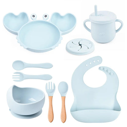 Collection of baby utensils and accessories in light blue on a white background