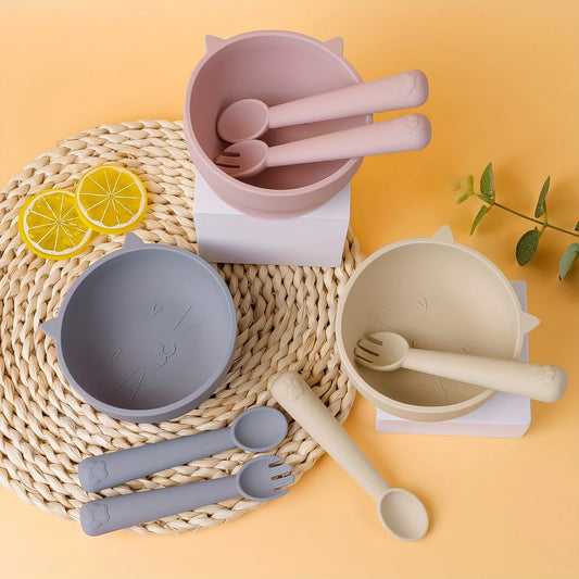 Two-piece baby feeding set featuring a round silicone suction bowl and a matching soft silicone spoon.