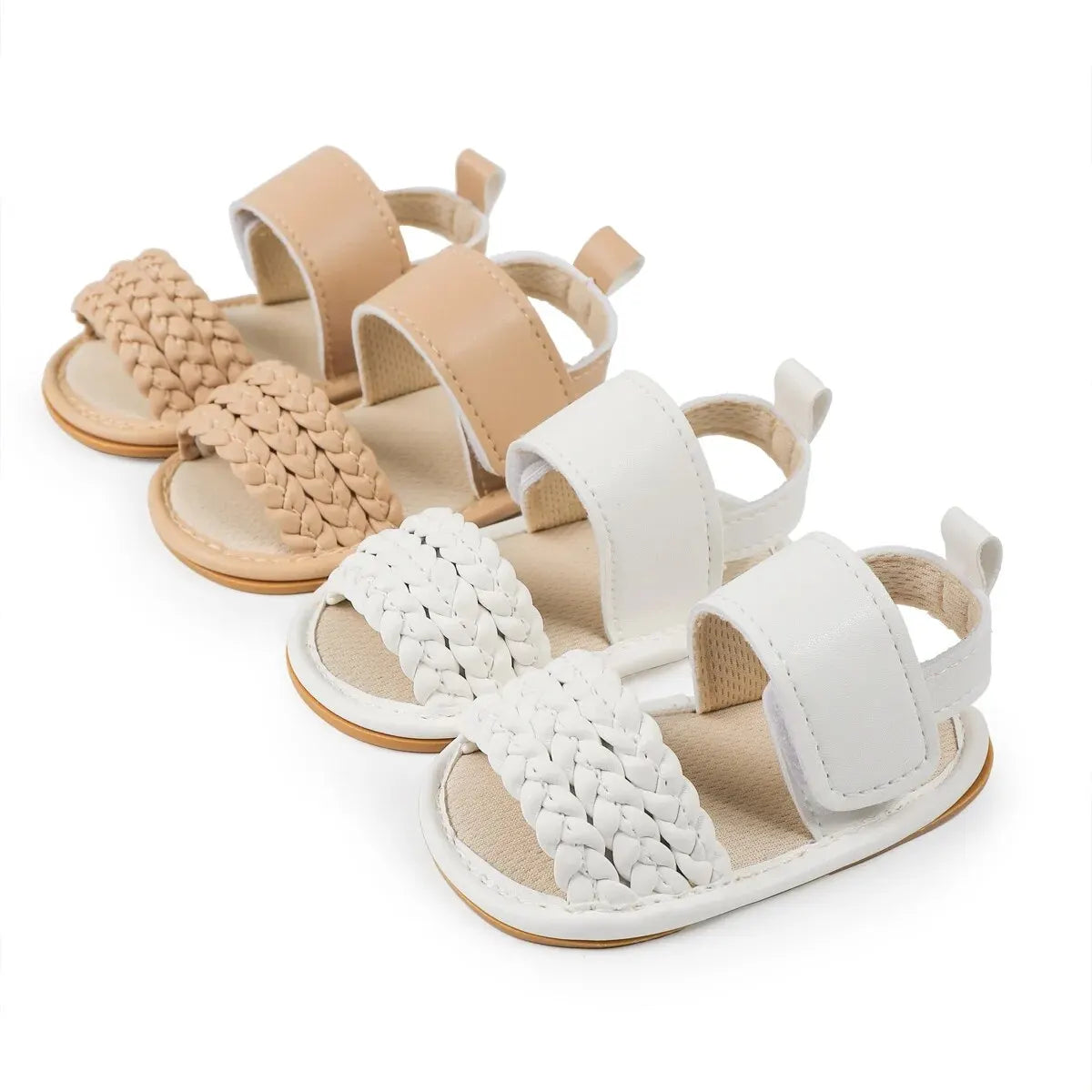 Pair of white and pair of beige baby girl woven faux leather sandals side by side.