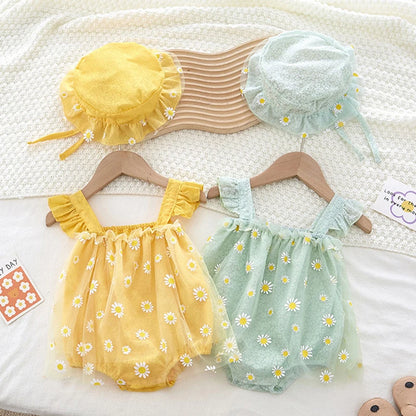 Two baby rompers with floral patterns on hangers, accompanied by matching hats.