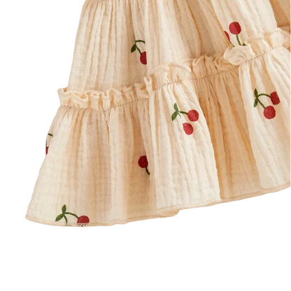 Beige skirt with cherry print on a white background