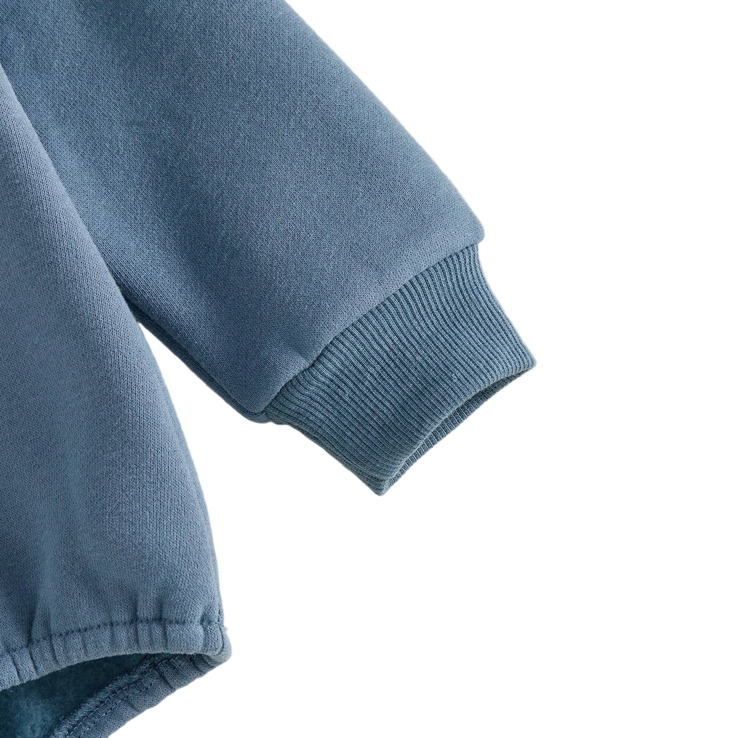 Close-up shot showing the high-quality ribbed wrist cuff and soft fleece fabric texture of the blue baby romper.