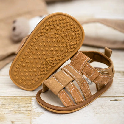 Close-up of the anti-slippery rubber outsole on a baby boy sandal, featuring a star-patterned grip for traction and stability during first steps.