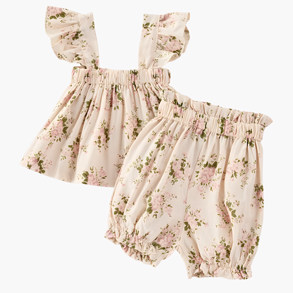 Floral baby romper set on a white background