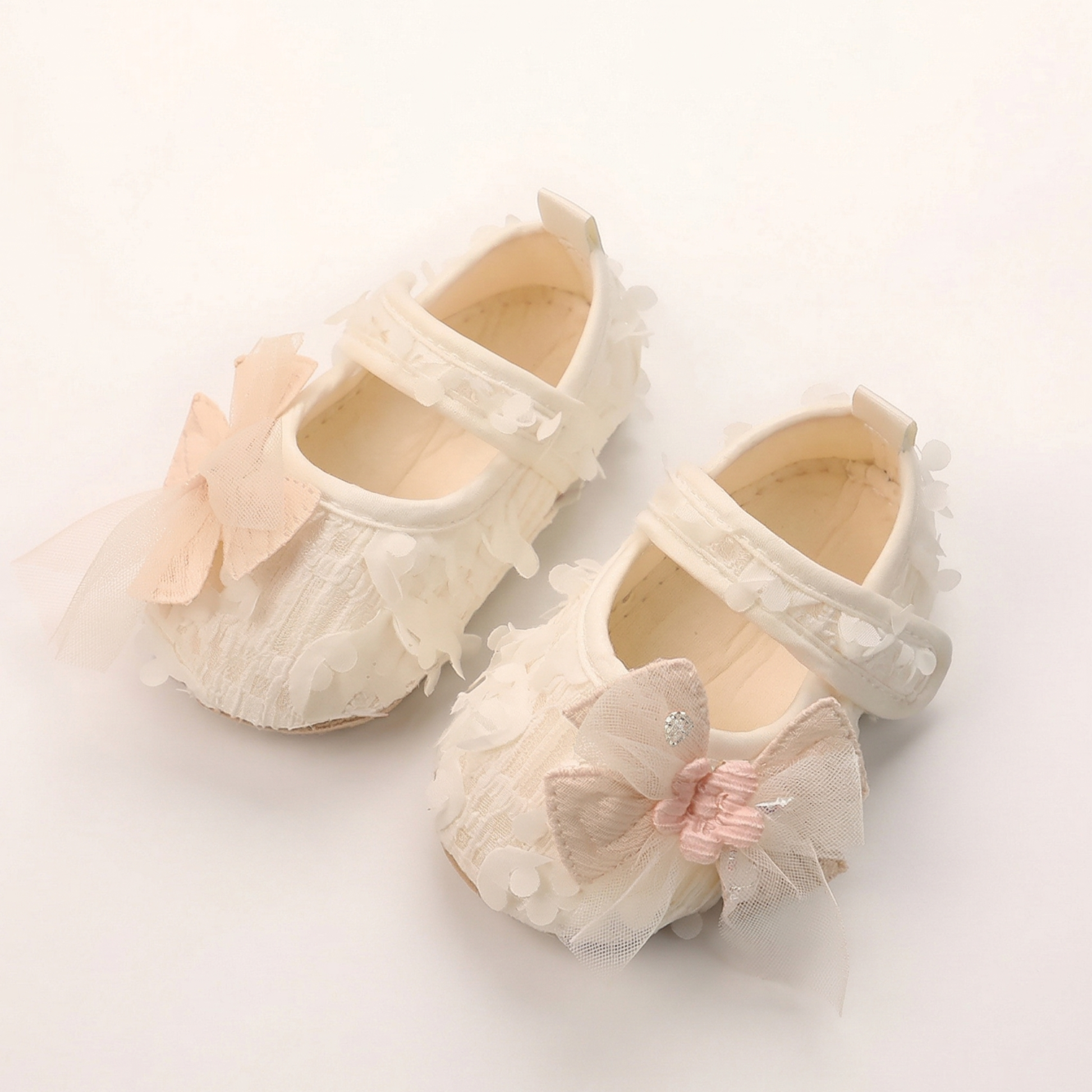 White baby girl princess first walker shoes with floral petal texture and mesh bow for infants 3-12 months.