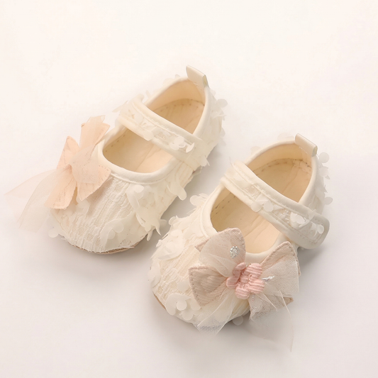 White baby girl princess first walker shoes with floral petal texture and mesh bow for infants 3-12 months.