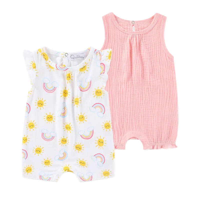 Baby girl summer outfit featuring a white flutter-sleeve romper with sun and rainbow graphics and a solid peach-pink textured muslin romper.