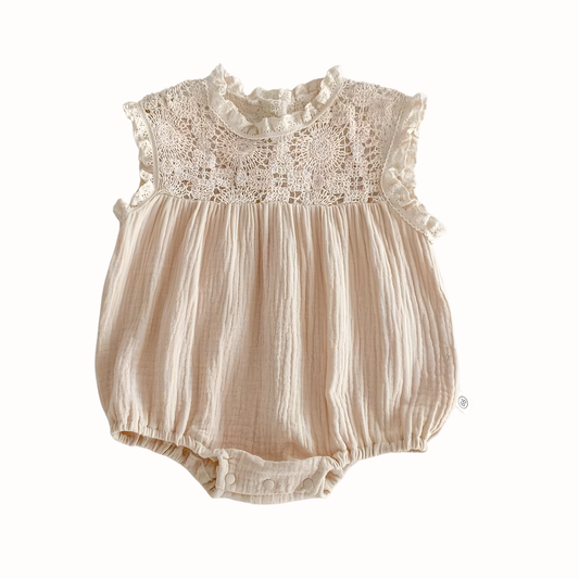 Baby Girl's muslin cotton vintage inspired romper with lace top on a white background