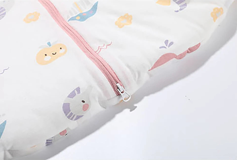 Close-up of the 2-way zipper at the bottom of the sleep sack, showing how it unzips from the bottom for easy late-night diaper changes without undressing the baby.