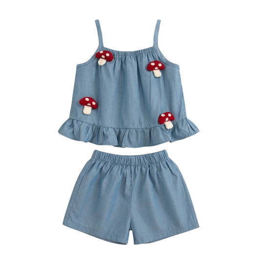 Baby and toddler girl two-piece blue cotton set featuring 3D red mushroom patches on a ruffle camisole top and matching shorts.