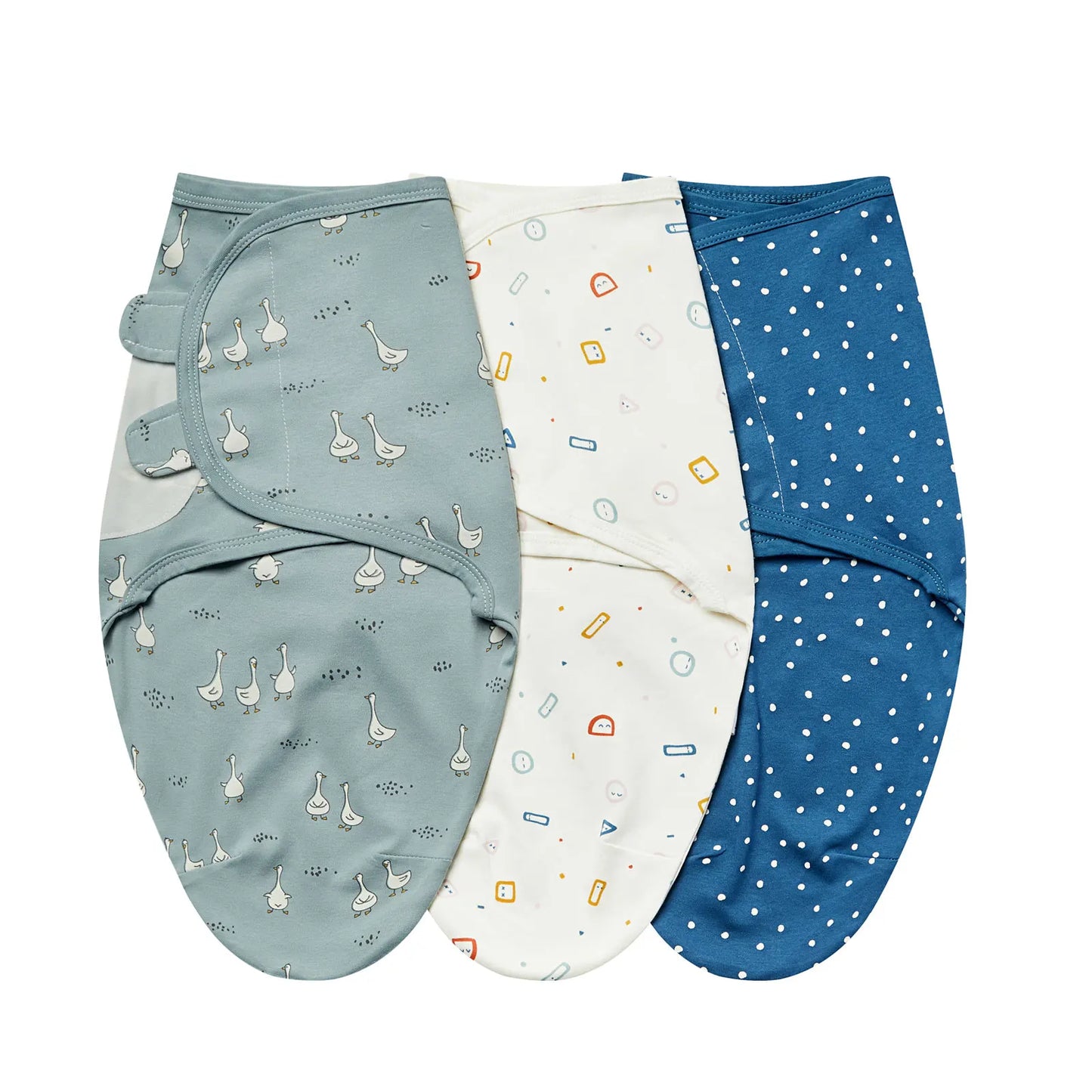 Blue Goose collection swaddle set featuring blue geese, geometric shapes, and navy polka dots.
