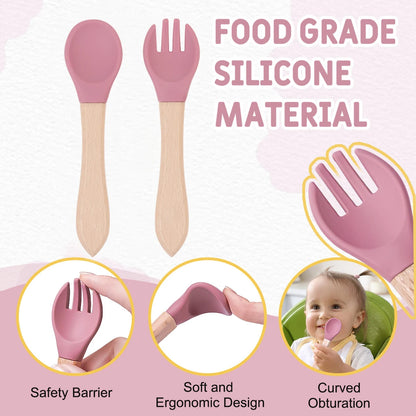 Baby utensils with pink silicone heads and wooden handles, labeled 'Food Grade Silicone Material'.