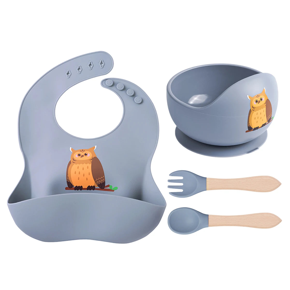 Children's dining set with bib, bowl, fork, and spoon featuring owl designs on a white background.