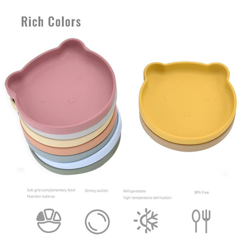 Stacked silicone dishes in various colors with a white background