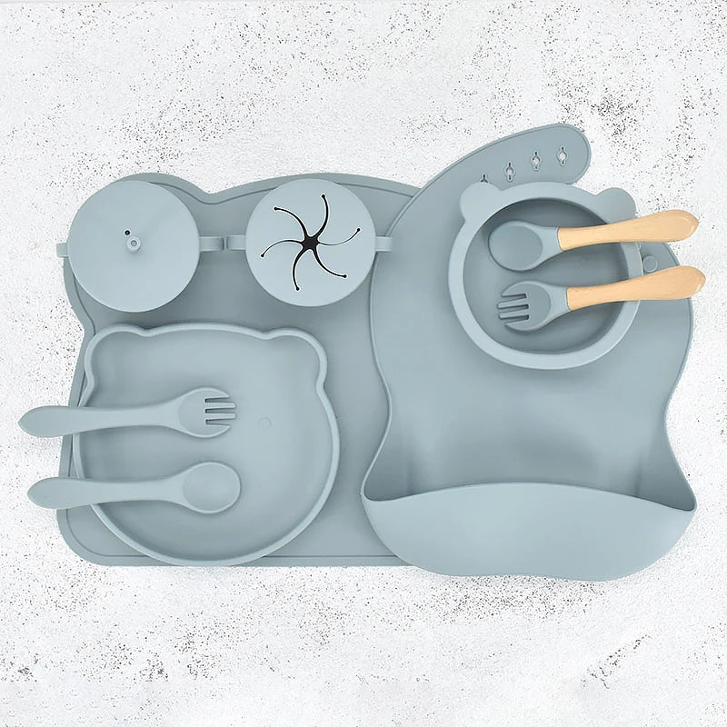 Children's silicone吃饭 set with plate, bowl, and utensils on a white background