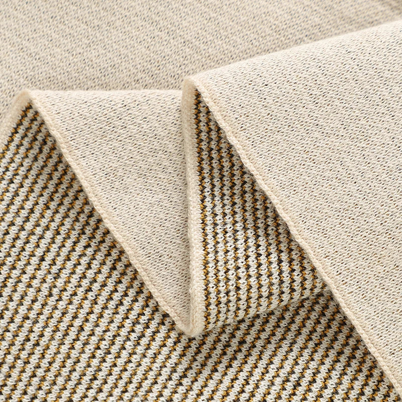 Close-up of a textured rug with a geometric pattern