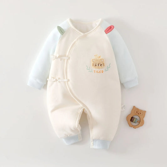 White and blue long-sleeve baby jumpsuit with a cute tiger patch and kimono-style side ties.