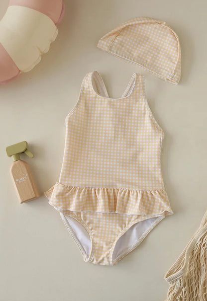 Bright Honey Yellow and white gingham check swimsuit for kids, featuring a classic ruffle skirt and a matching yellow sun-protective swim bonnet.