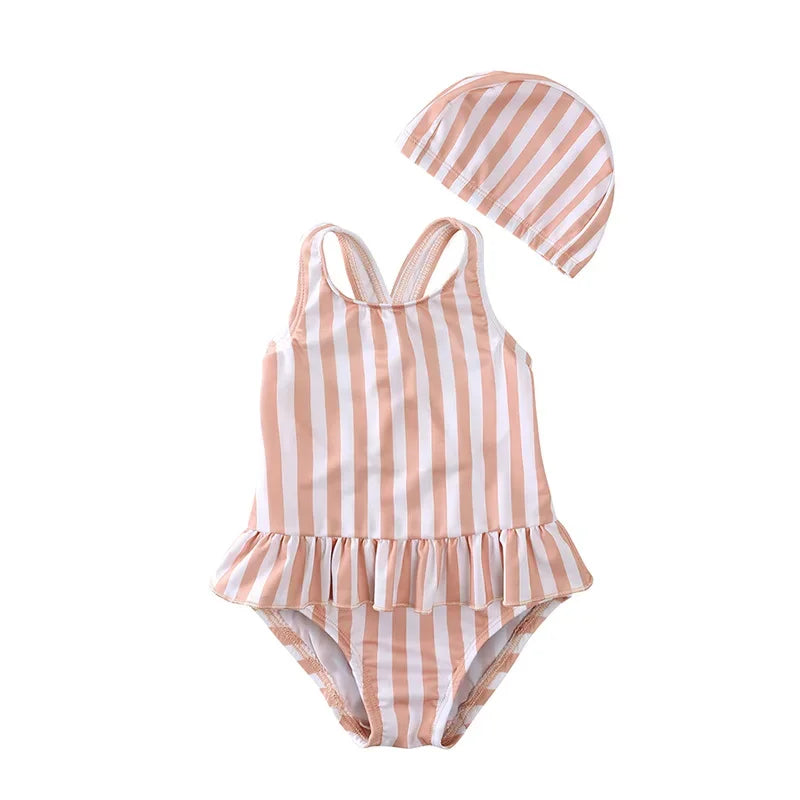 Classic Sunrise Stripe swimsuit in peach and white for toddlers and kids with cross-back straps.