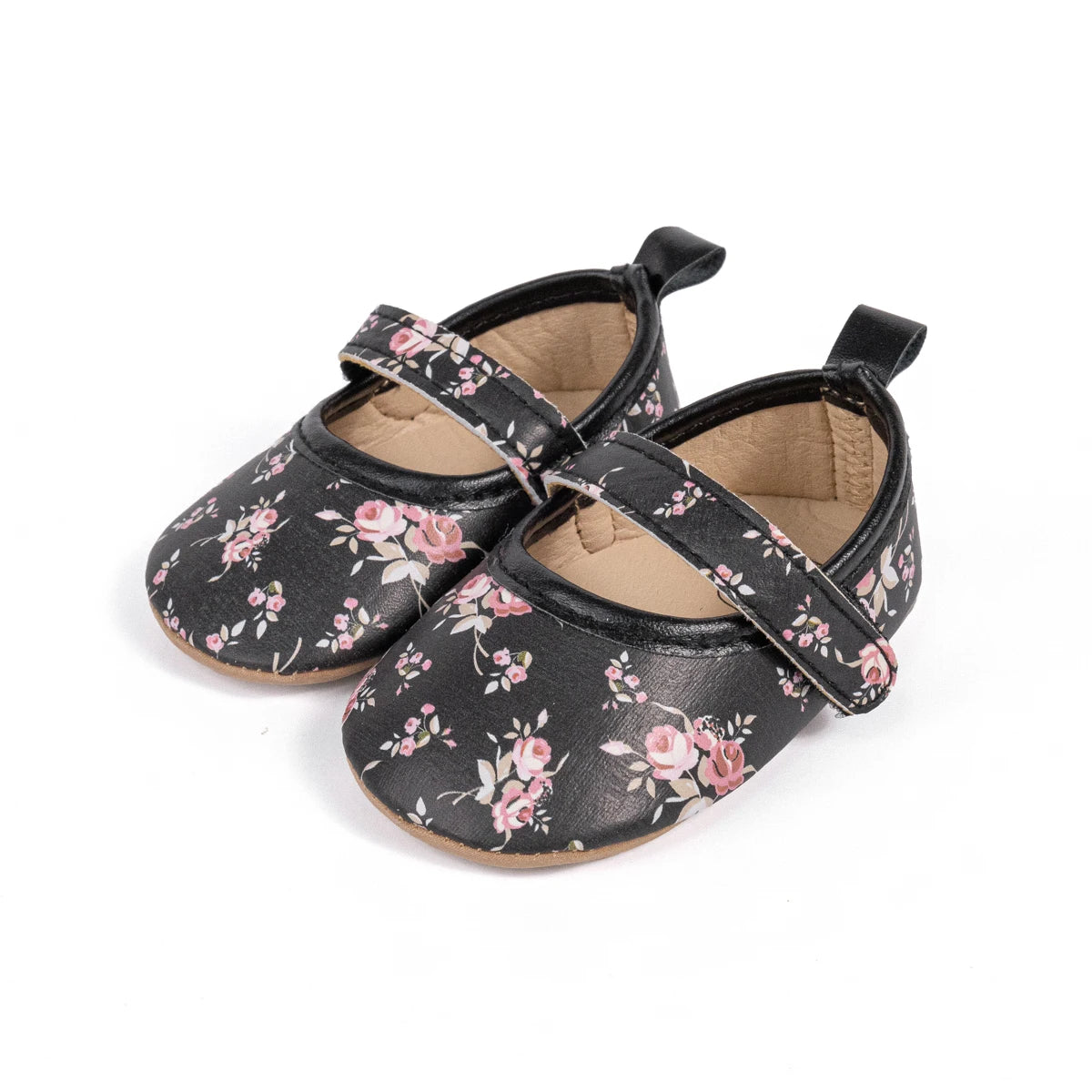 Front angled view of black cottagecore infant floral Mary Jane shoes with thin flexible rubber soles.