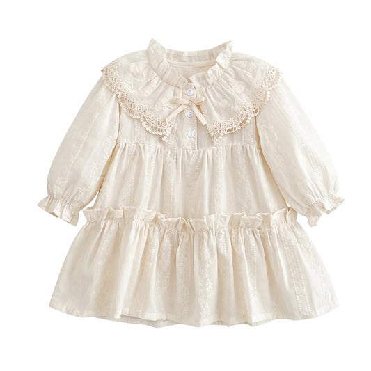 Off-white vintage toddler and girls long sleeve tiered dress featuring an oversized lace Peter Pan collar, bishop sleeves, and front bow detail.