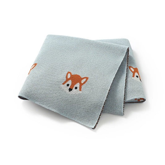 Folded baby blue 100% cotton soft knit baby blanket featuring orange fox pattern