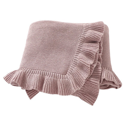 100% cotton knit baby blanket with ruffle edge in dusty rose pink folded on white background