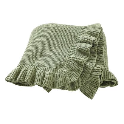 100% cotton knit baby blanket with ruffle edge in sage green folded on white background