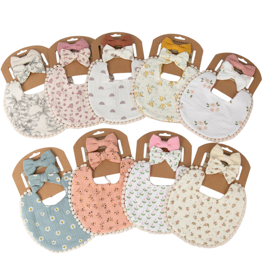 Complete collection of 3-piece double-gauze muslin baby girl bibs and headband sets in various vintage and boho floral and earth-tone patterns.