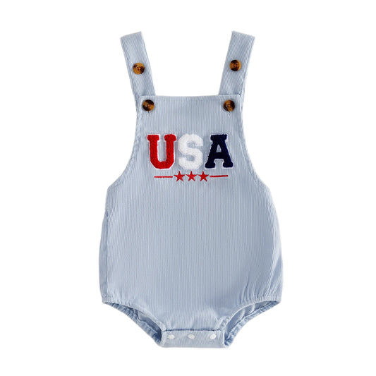 Infant baby wearing a light blue sleeveless bubble romper with embroidered USA letters and red stars for a 4th of July outfit.