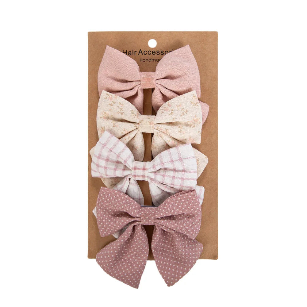 Kidsely Antique Petal collection with rosewood, cream floral, pink grid, and mauve polka dot large fabric bows.