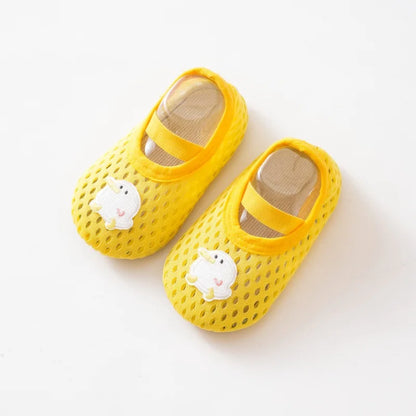 Vibrant yellow baby beach shoes with a cheerful duckling patch and quick-dry material.