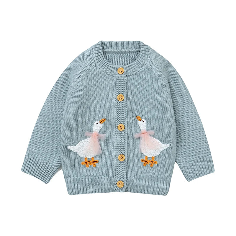 Baby blue baby and toddler girls knit cardigan sweater featuring two embroidered geese, flat lay on a white background.
