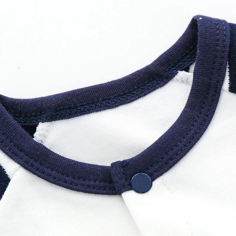 Close up of the navy blue ribbed neckline and top snap closure on the infant cotton baseball romper.