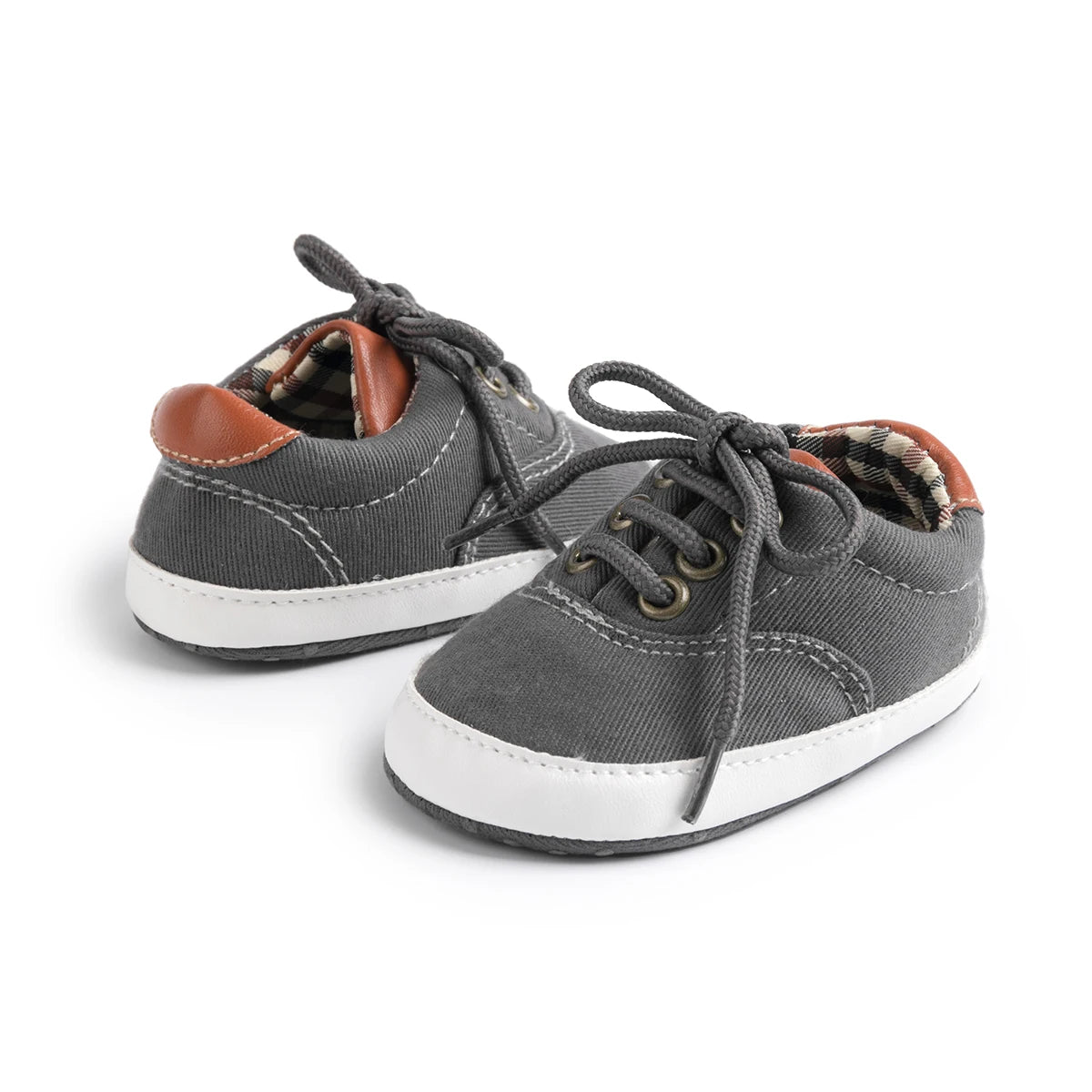 Charcoal grey toddler canvas shoes with flexible pre-walker soles and secure lace-up closure.