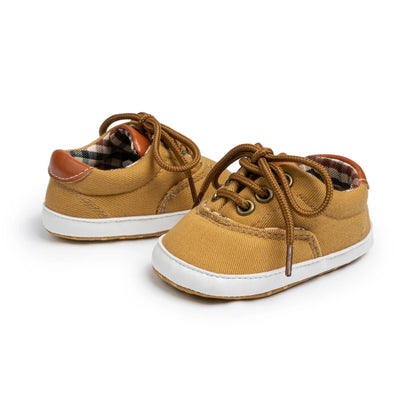 Baby boy canvas first walker shoes in heritage tan with classic plaid lining and non-slip soft soles.