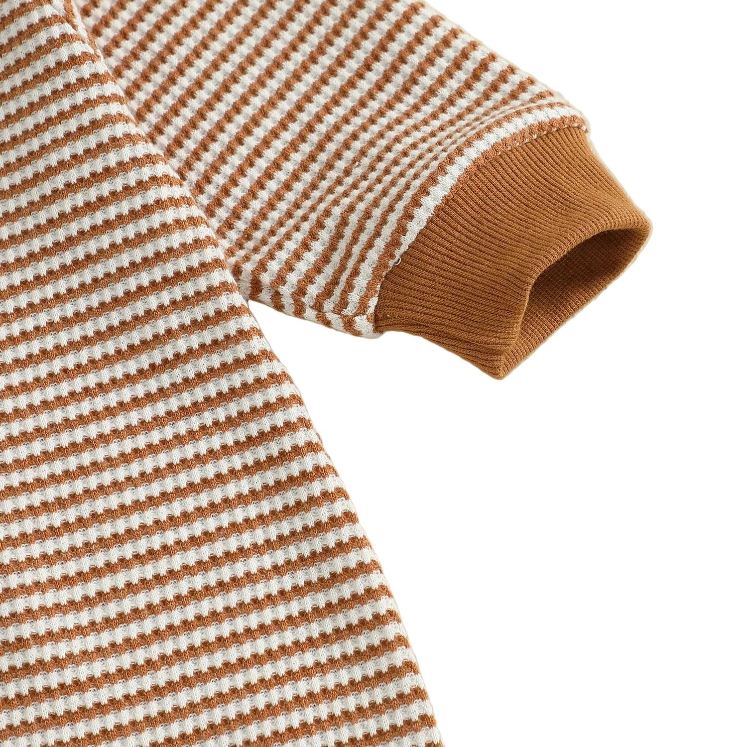 Close up of the long sleeve and ribbed brown wrist cuff on the baby boy striped football romper.
