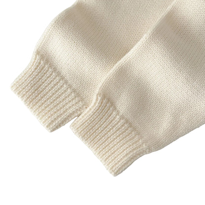 Close-up of the soft cream ribbed knit long sleeve cuffs on the baby boy formal romper.