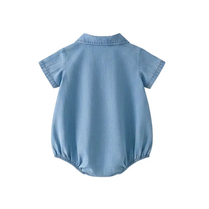Back view of the light blue short-sleeve baby romper showing the clean silhouette and high-quality stitching.